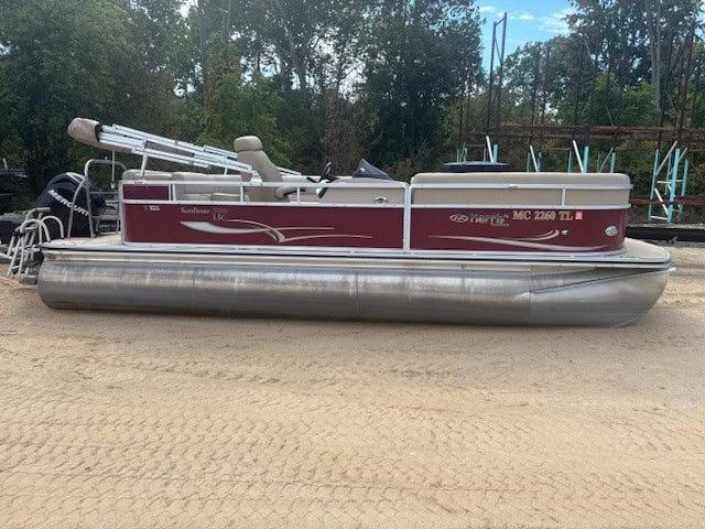 Pontoon boat at Camp & Cruise with Yamaha outboard motor and spacious deck.