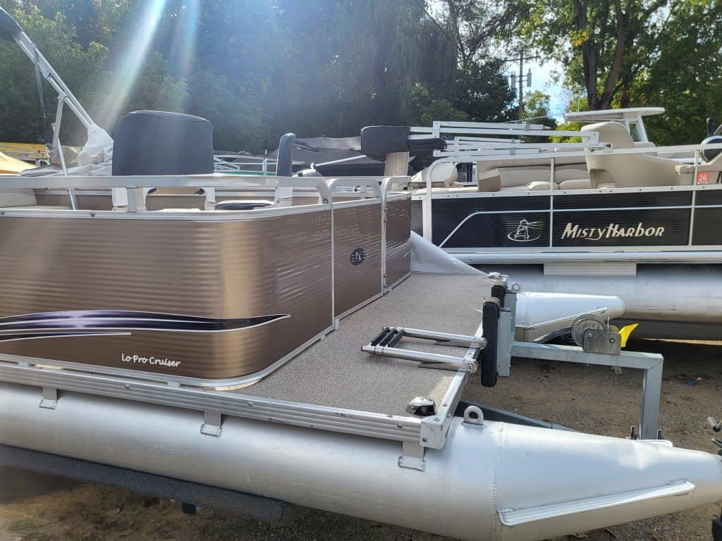 Image of pontoon boats on display, ready for water adventures at Camp & Cruise.