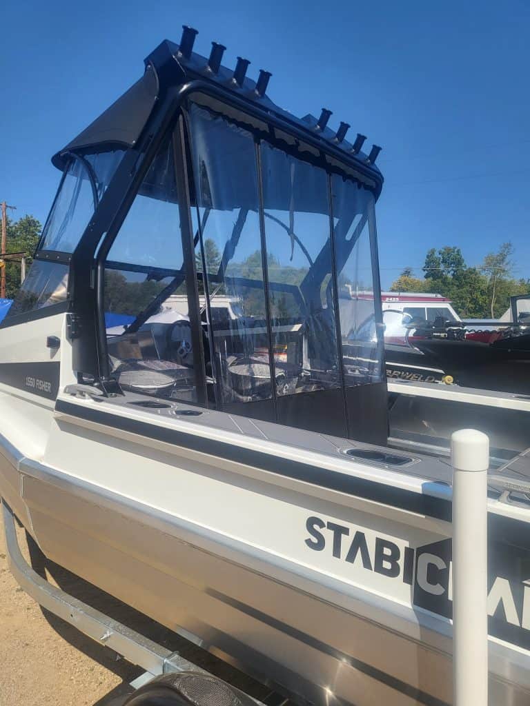 High-quality fishing and recreational boat at Camp & Cruise with durable canopy.