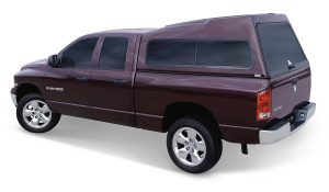 Ram 1500 vehicle with camper shell, ideal for outdoor adventure and utility conversion, available at Camp & Cruise.
