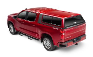 Modern red Chevrolet Silverado with truck bed cover, perfect for outdoor and off-road adventures.