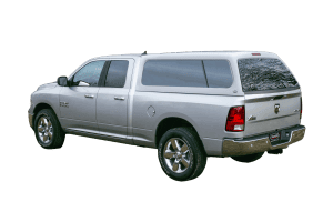High-quality silver Ram 1500 truck with camper shell for outdoor adventures and cargo needs.