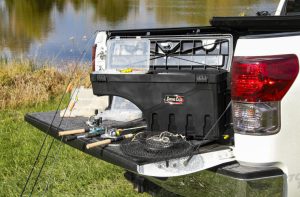 Fishing gear organized in the truck bed, ready for outdoor fishing adventures.