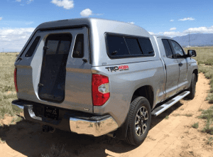 High-quality off-road truck with Camper canopy for outdoor use.