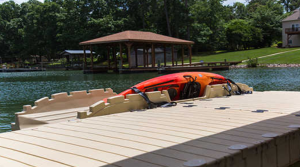 Kayak on dock at Camp & Cruise, ideal for water sports and outdoor activities.
