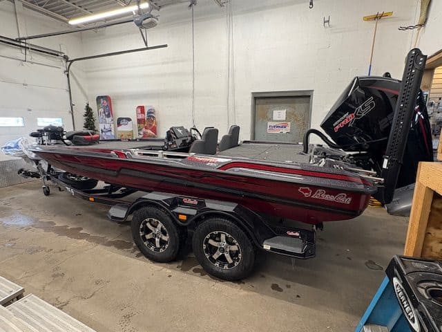Bass boat with outboard motor on display at Hall's Sport Center.