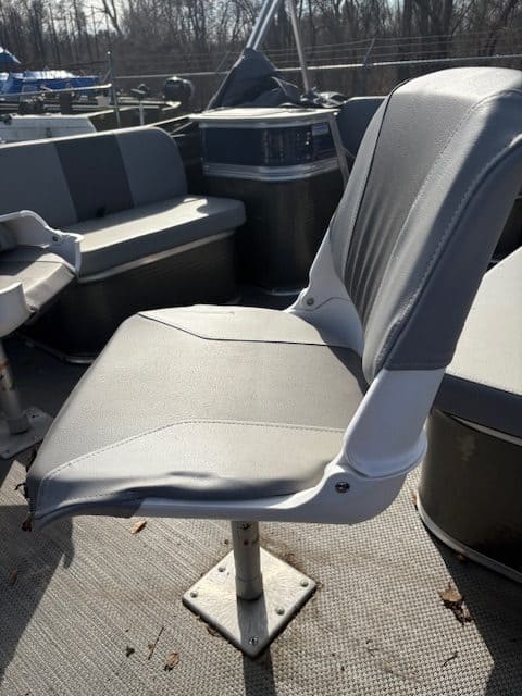 Boat seat at Hall's Sport Center, outdoor setting, boat accessories visible.