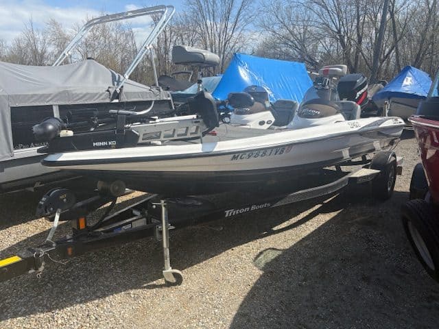Speedboat on trailer at Hall's Sport Center, ideal for water sports and boating adventures.